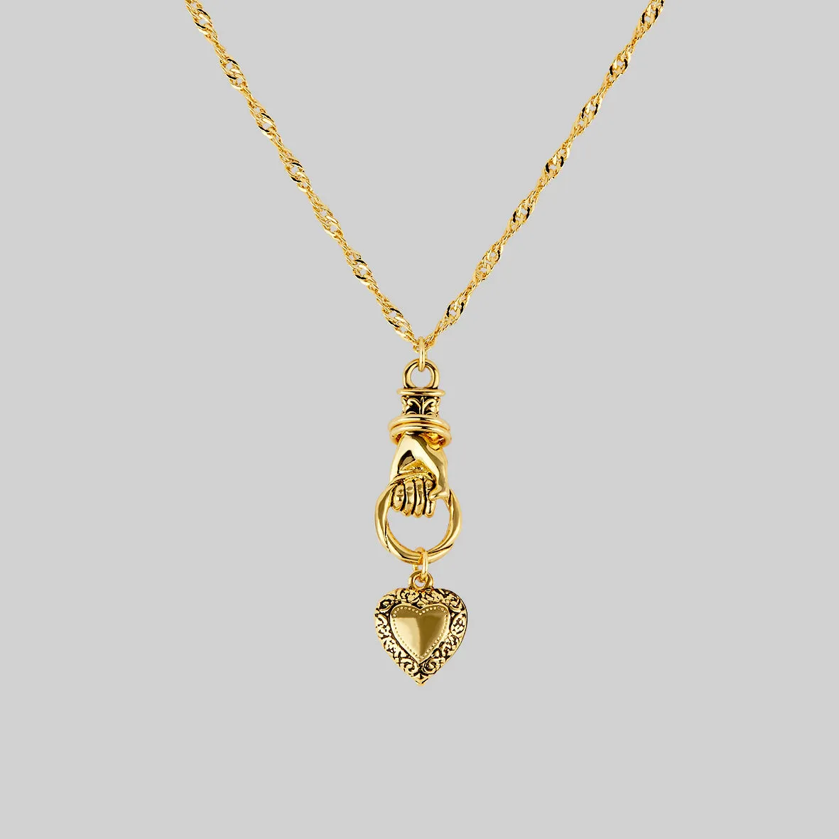 ALL OF ME. Hand Grasping Heart Necklace - Gold