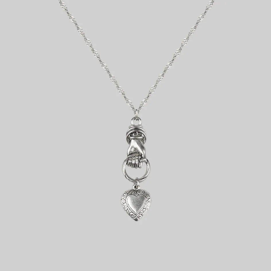 ALL OF ME. Hand Grasping Heart Necklace - Silver